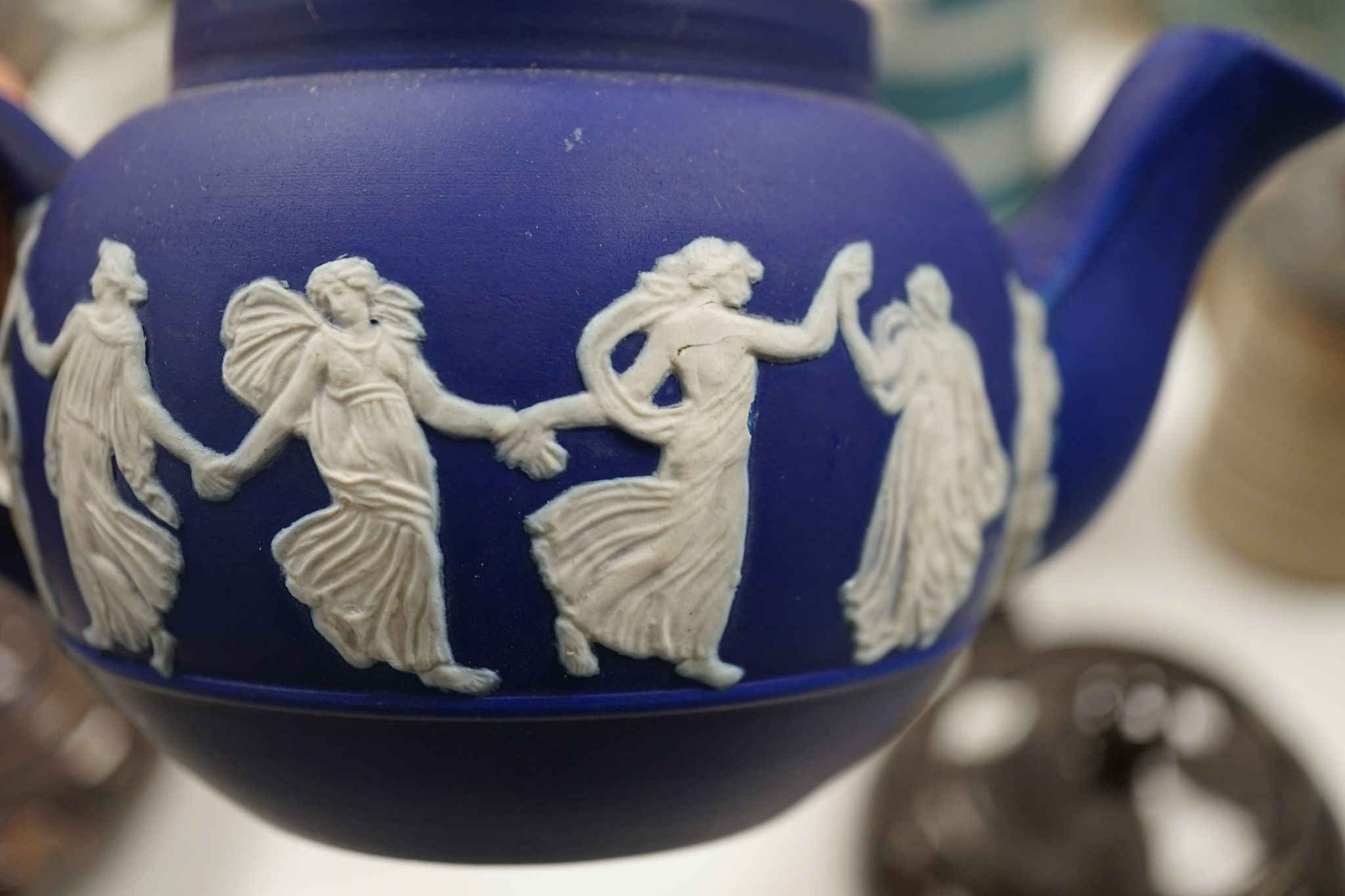 A collection of Dudson stoneware, including jugs, teapots, cream jugs etc, many decorated in low relief